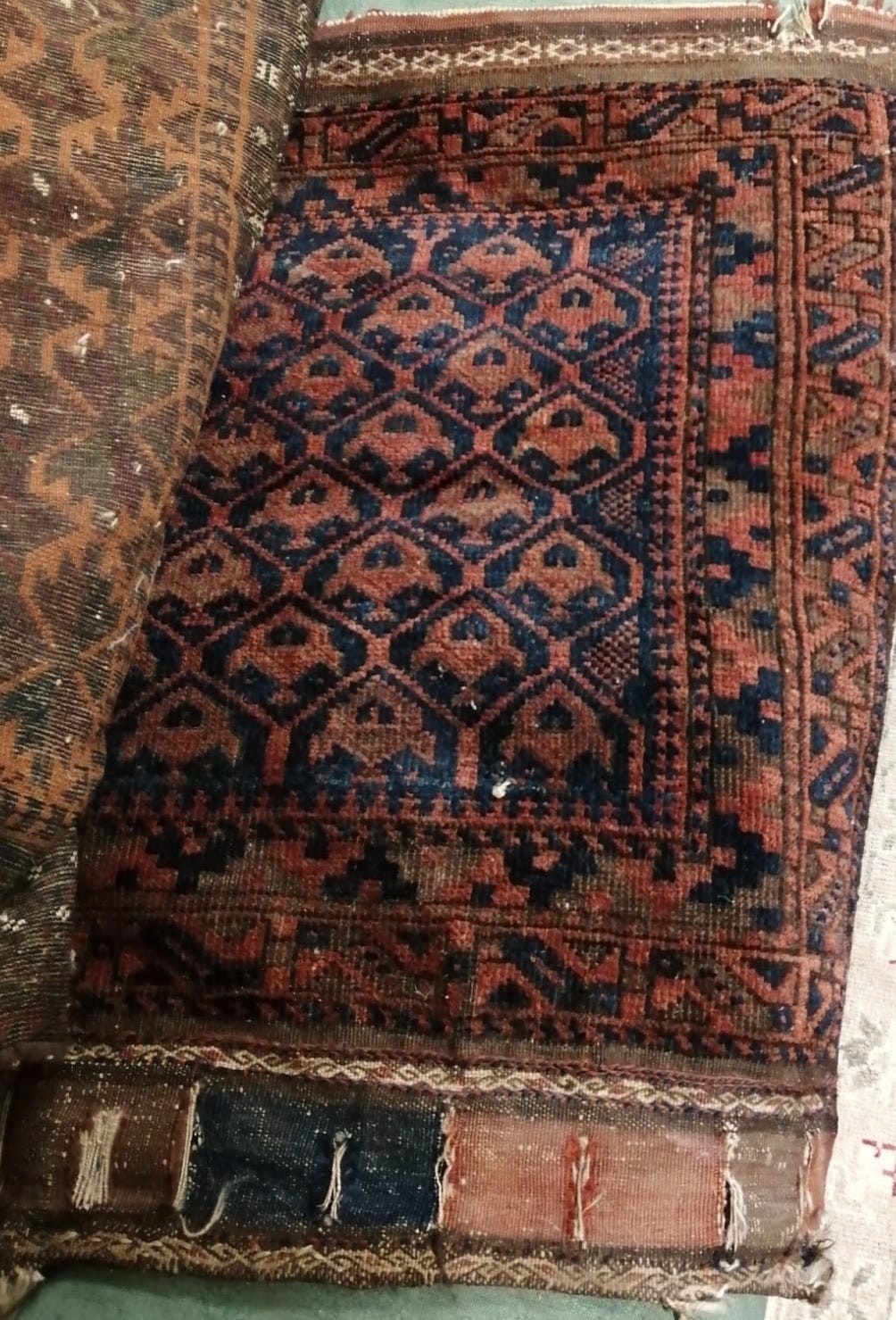 Six antique Belouch bags and faces, largest 200 x 52cm